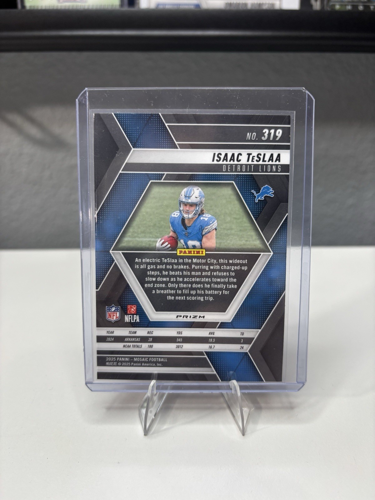 2025 Panini Mosaic – Rookies Isaac Teslaa #319 Red Camo Mosaic Prizm (RC)