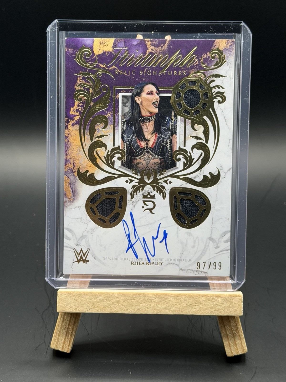 2025 Topps Royalty WWE Rhea Ripley Triumph Relic Signatures Auto Autograph #/99