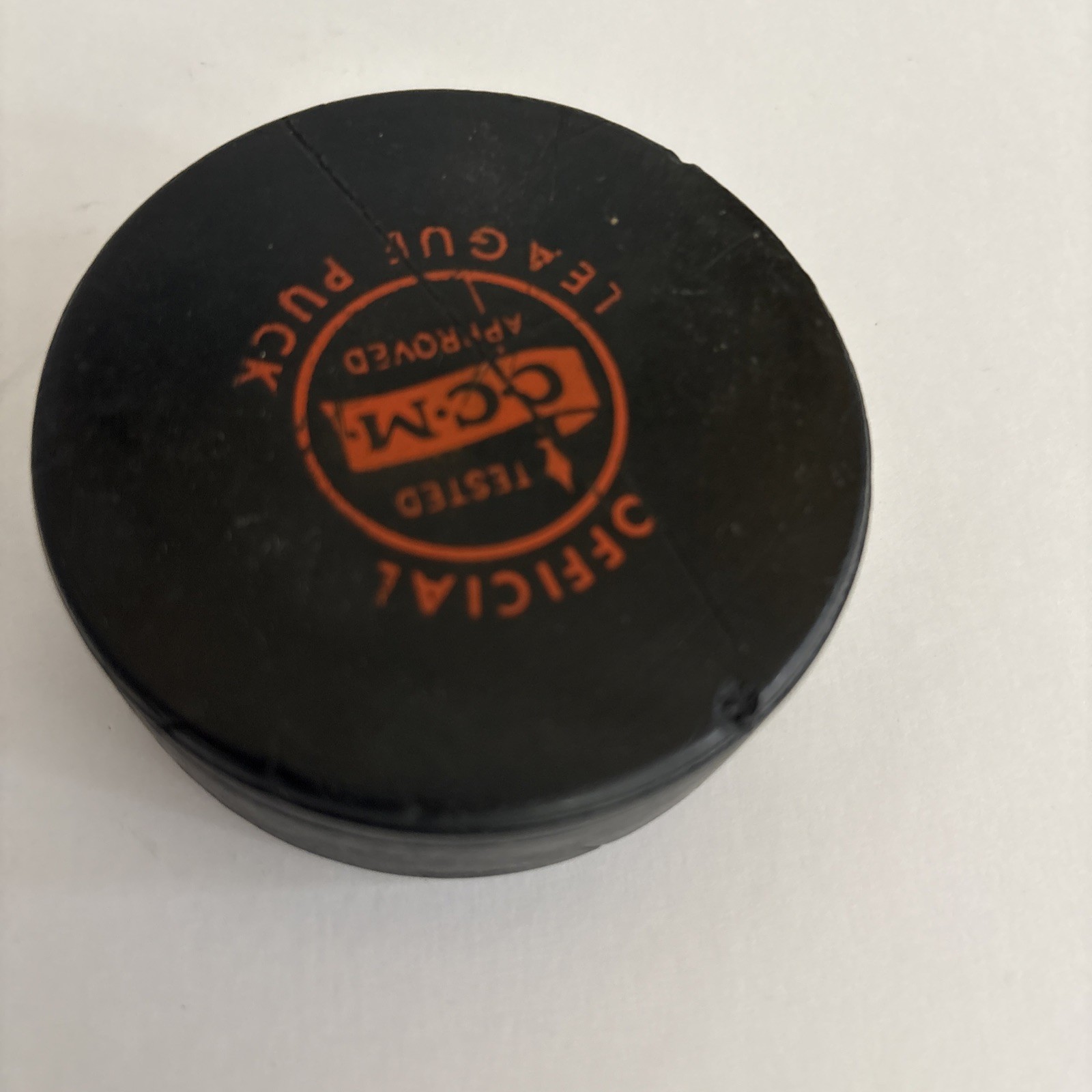 Tested Approved Official CCM League Hockey Puck Black Orange Logo