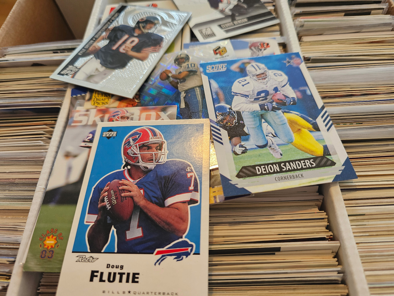 APPROX 3000 FOOTBALL CARDS VARY YEARS AND MAKES