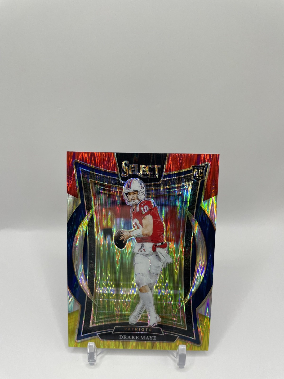 2024 Panini Select – Concourse Drake Maye #27 Red & Yellow Shock Prizm (RC)