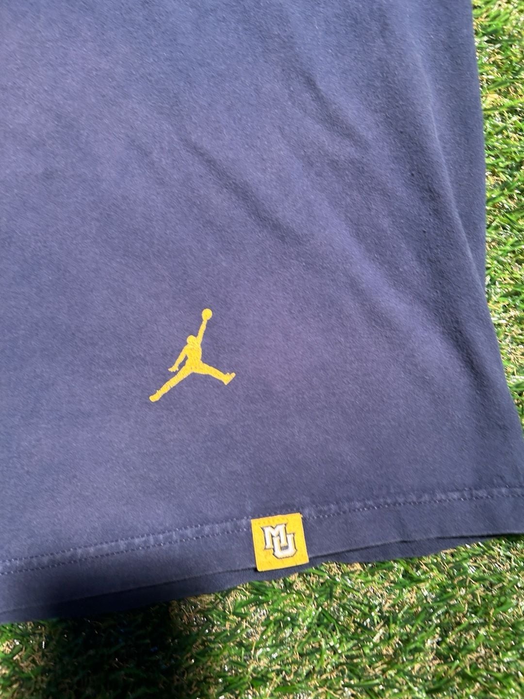 Nike Jordan Marquette Golden Eagles 1881 Cura Personalis Graphic T-Shirt