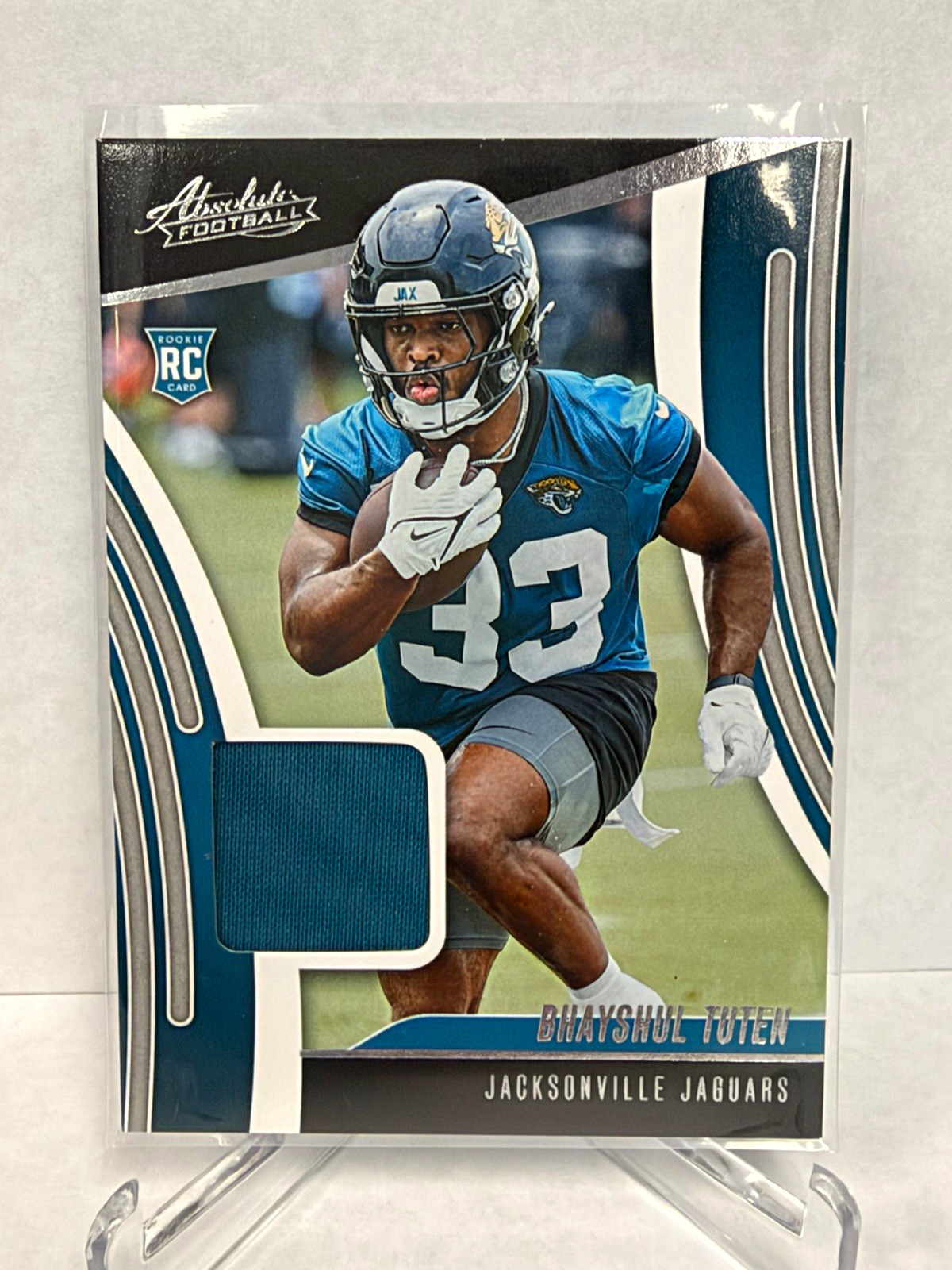 Panini 2025 NFL Rookie Memorabilia 2-Card Lot Tuten ARM-BTN, Williams FYFBH-KWS