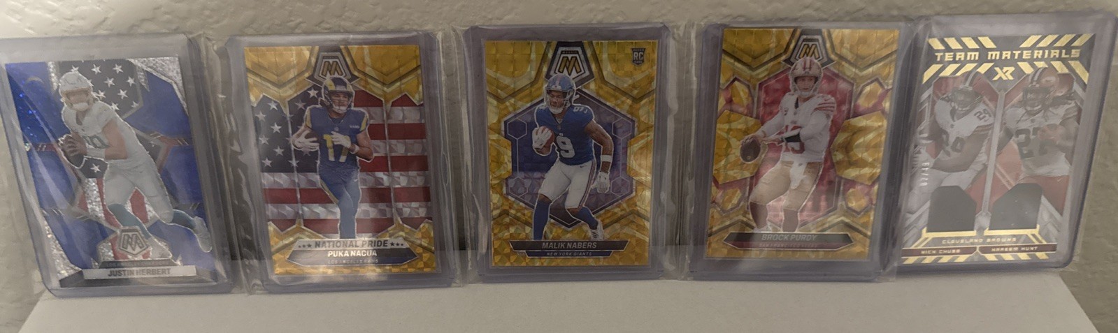 NFL Herbert-Blue Sparkle, Purdy/Nabers/Puka-Yellow, Chubb/Hunt Team Materials/49