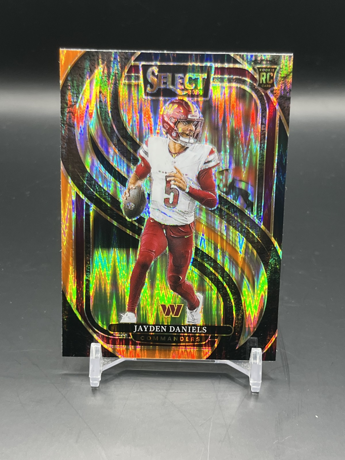 2024 Panini Select – Premier Level Jayden Daniels #112 Black & Orange Shock RC
