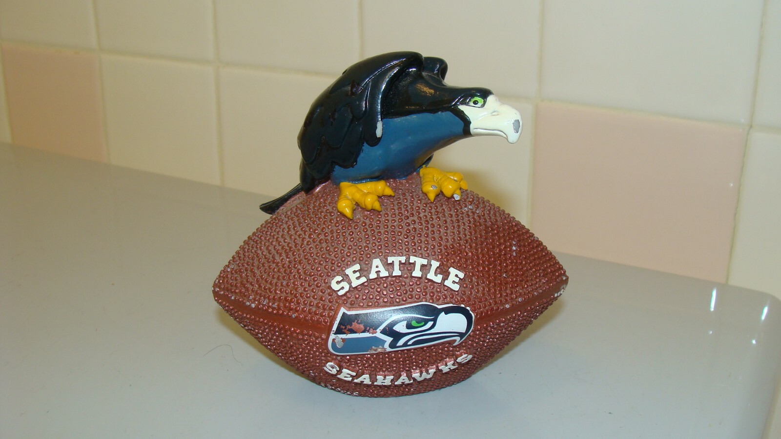 NFL Seattle Seahawks Souvenir Hawk Bird Sitting on Football 4.6″ x 3″ and 4.2″T