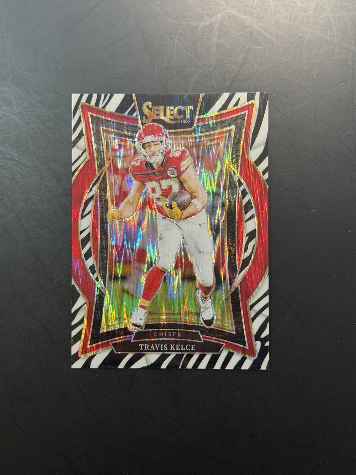 Travis Kelce 2024 Select Concourse Zebra Shock Prizm Kansas City Chiefs #97 SSP