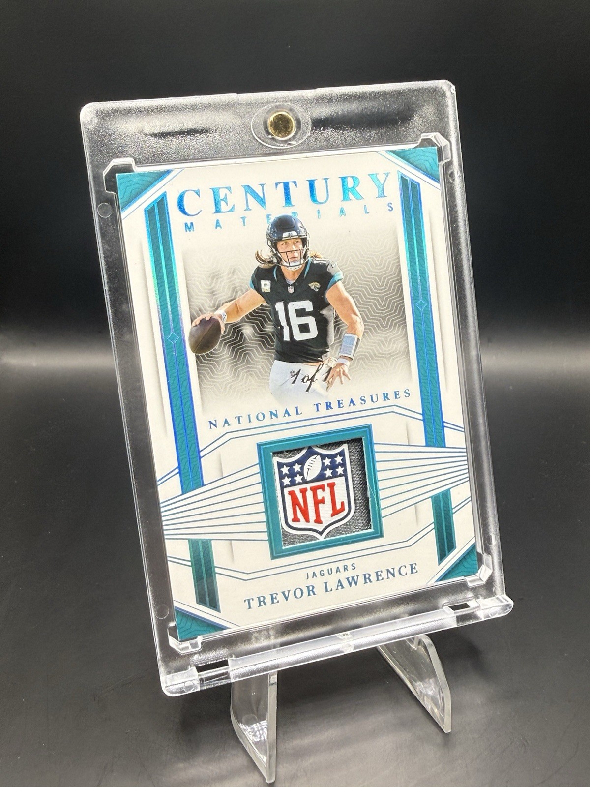 2023 National Treasures- Century Materials Trevor Lawrence NFL Shield /1 Jaguars