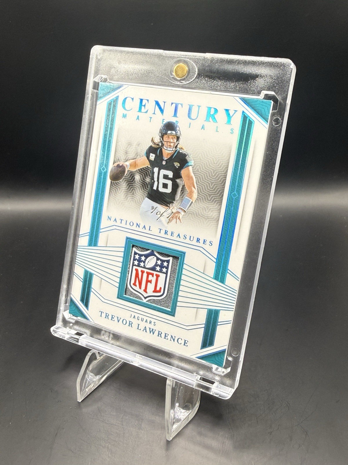 2023 National Treasures- Century Materials Trevor Lawrence NFL Shield /1 Jaguars