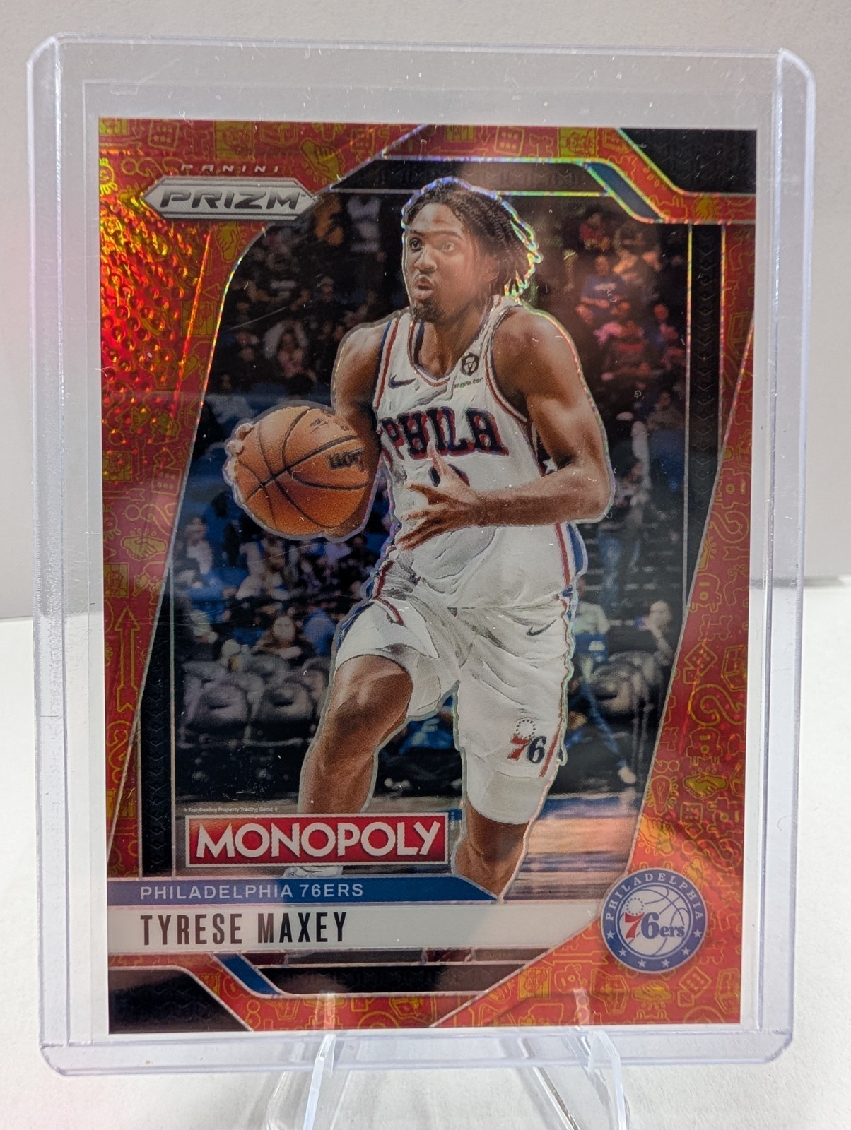 2024-25 Panini Prizm Monopoly – Tyrese Maxey #2 Orange Icons Prizm 1284/1499