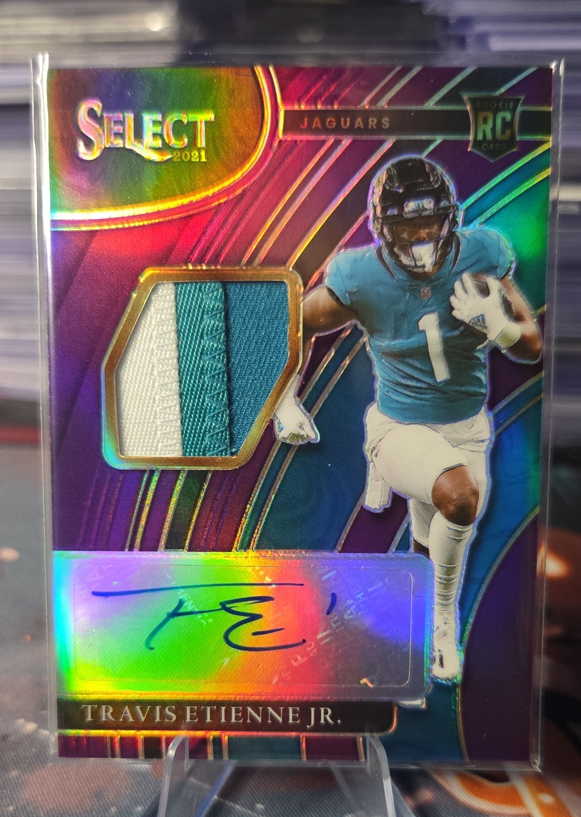 2021 Panini Select – Rookie Signature Memorabilia Travis Etienne #RSM-TET Purple