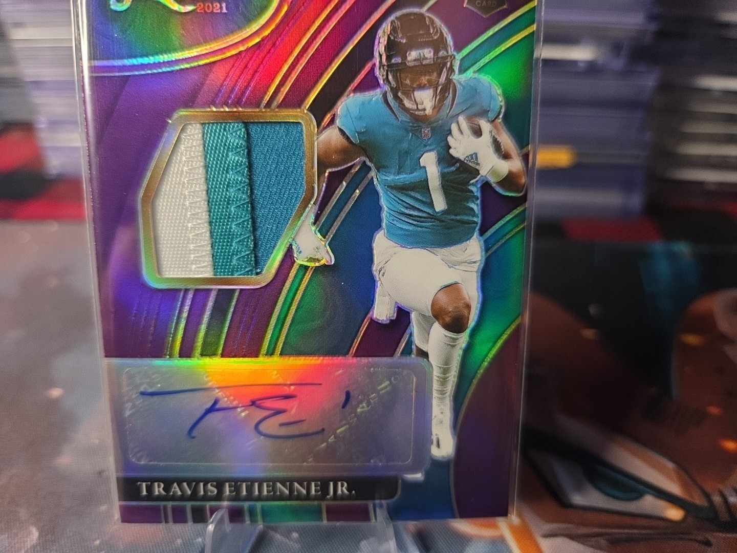 2021 Panini Select – Rookie Signature Memorabilia Travis Etienne #RSM-TET Purple