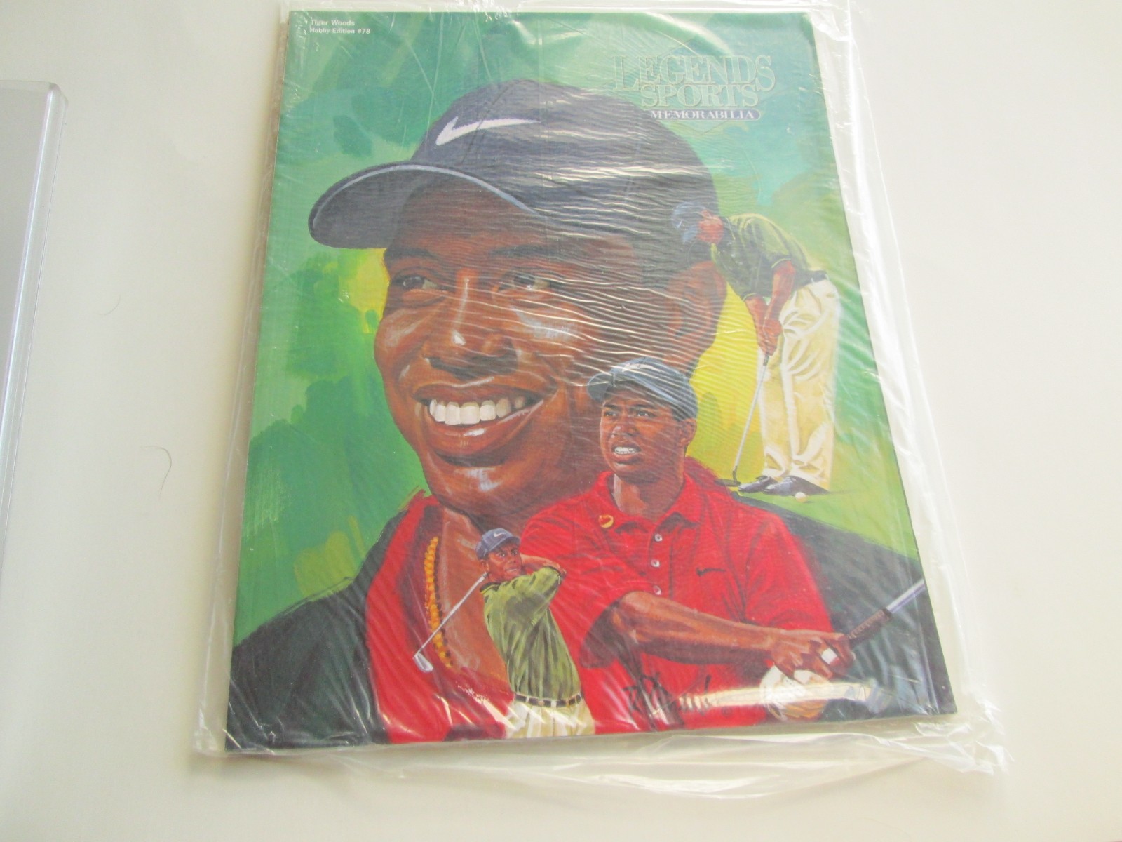 1997 LEGENDS SPORTS # 78 HOBBY EDITION, SEALED WITH CARDS, TIGER WOODS COVER