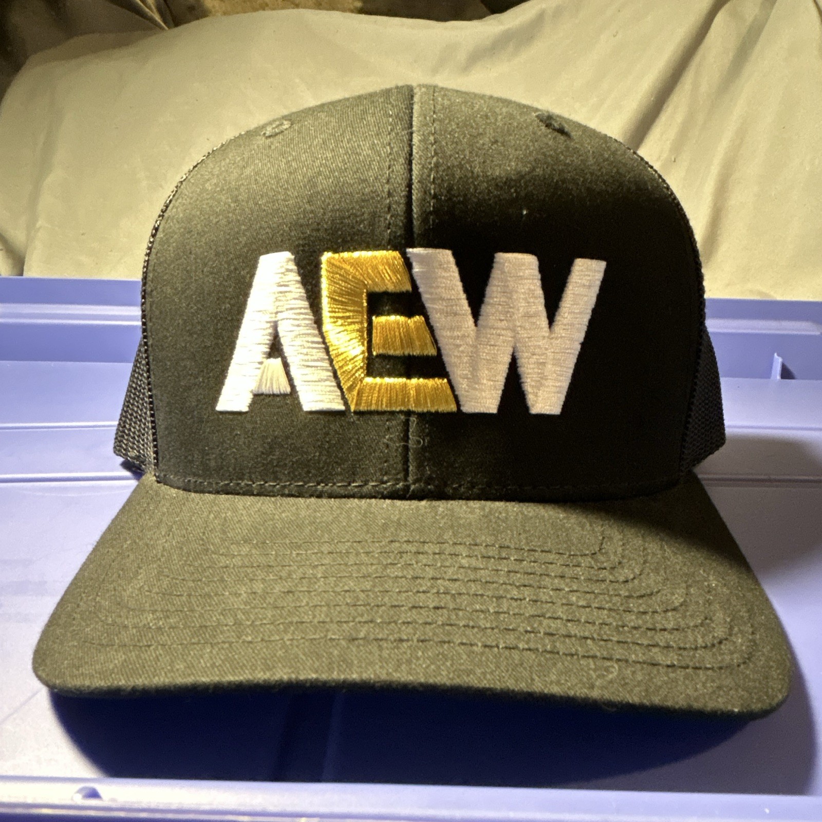The Classics AEW Black Mesh Trucker Hat Embroidered Logo