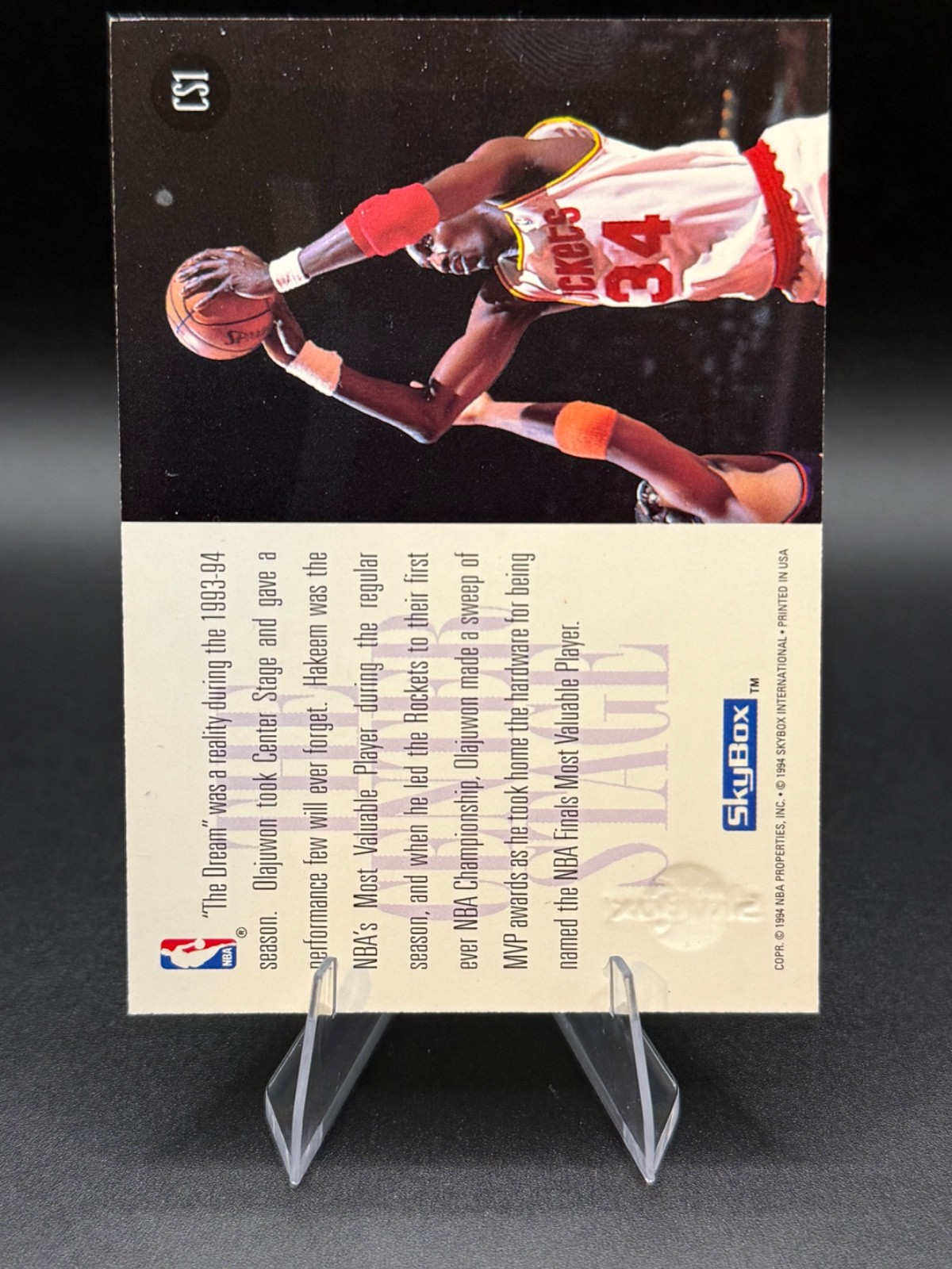1994-95 Skybox – The Center Stage Hakeem Olajuwon #CS1- Houston Rockets NG1